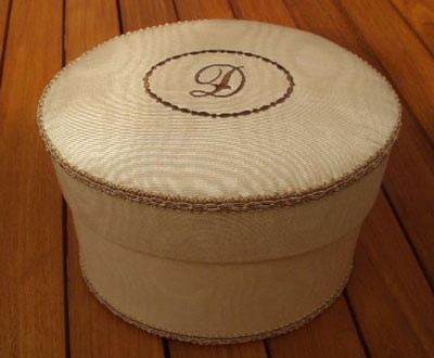 Oval box with embroidered initial