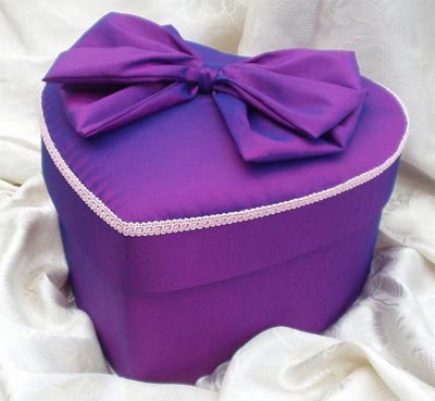 Heart shaped purple taffeta box with baby pink trimming