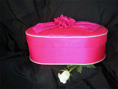 Oval Box covered in magenta pure dupion silk fabric 